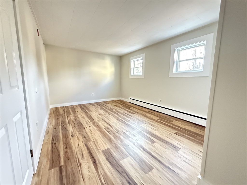 866 Center Street, Unit 2 Middleboro, MA 02346 - Photo 7 of 11 a view of a room with wooden floor and entryway