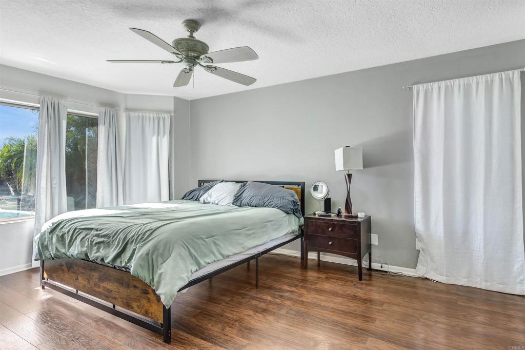 4559 Coronado Drive Oceanside, CA 92057 - Photo 14 of 29 a bedroom with a bed and a table