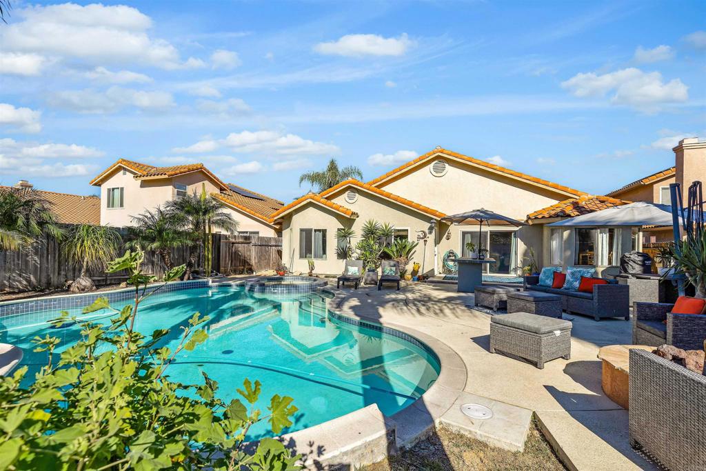 4559 Coronado Drive Oceanside, CA 92057 - Photo 2 of 29 a front view of a house with garden