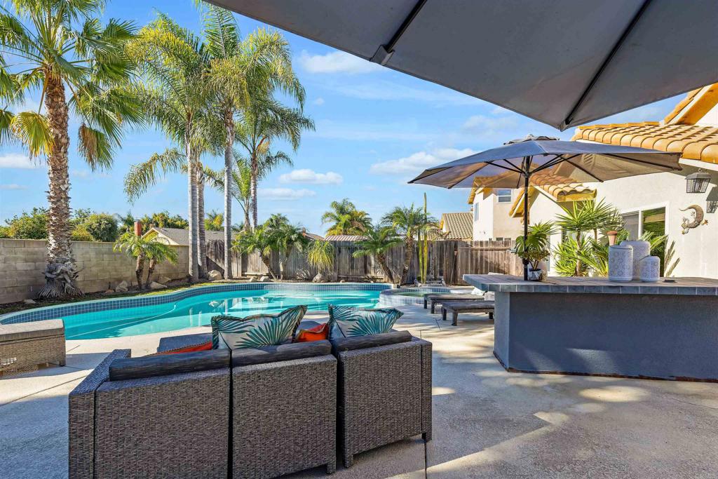 4559 Coronado Drive Oceanside, CA 92057 - Photo 26 of 29 a living room with patio and furniture