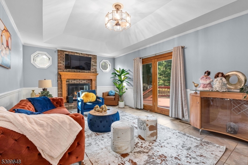 512 Township Line Road Hillsborough, NJ 08844 - Photo 11 of 40 a living room with furniture fireplace and flat screen tv
