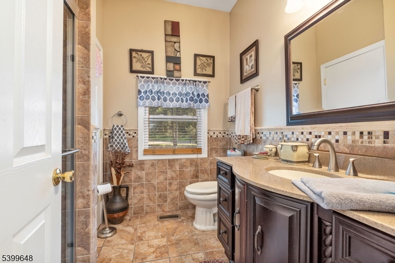 512 Township Line Road Hillsborough, NJ 08844 - Photo 15 of 40 a bathroom with a sink and a toilet