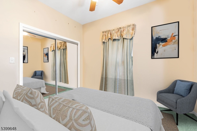 512 Township Line Road Hillsborough, NJ 08844 - Photo 16 of 40 a bedroom with a bed and a couch