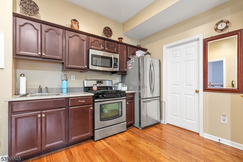 512 Township Line Road Hillsborough, NJ 08844 - Photo 17 of 40 a kitchen with stainless steel appliances granite countertop a refrigerator stove top oven and sink