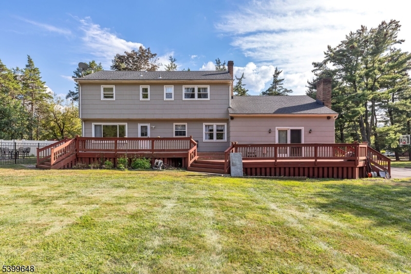 512 Township Line Road Hillsborough, NJ 08844 - Photo 30 of 40 a view of a house with a big yard and large trees