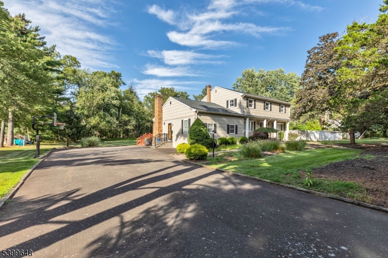 512 Township Line Road Hillsborough, NJ 08844 - Photo 36 of 40 a front view of a house with a yard and garage