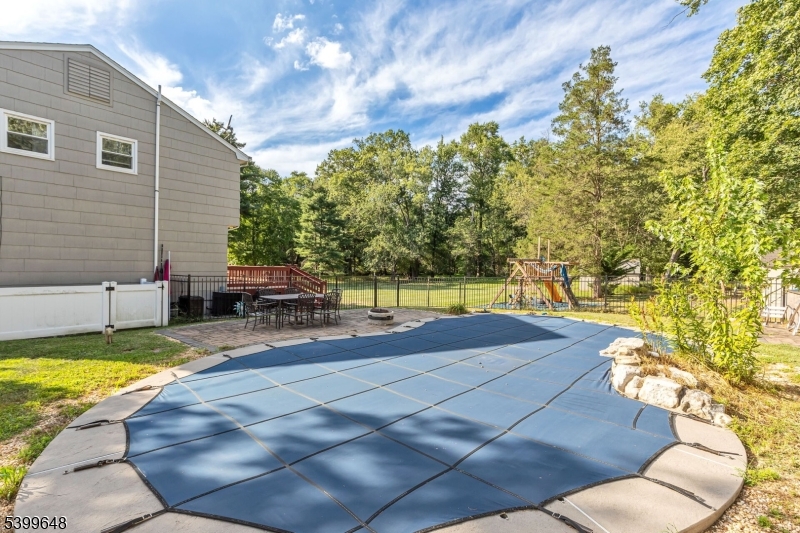 512 Township Line Road Hillsborough, NJ 08844 - Photo 38 of 40 a view of a swimming pool with a patio