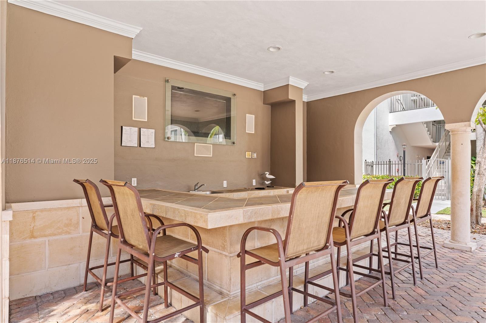 6851 Southwest 44th Street, Unit 210 Miami, FL 33155 - Photo 16 of 23 a view of a dining room with furniture and wooden floor