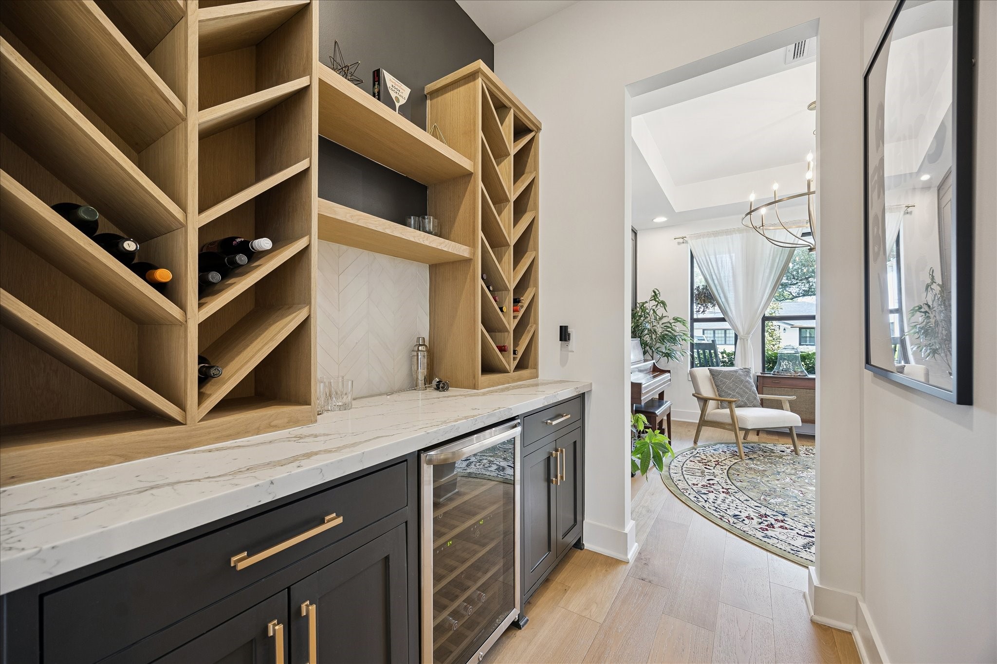 1313 Thornton Road Houston, TX 77018 - Photo 19 of 32 A thoughtfully designed butler's pantry features custom wine storage, quartz countertops, built-in cabinetry, and a beverage refrigerator—perfect for effortless entertaining and everyday convenience.