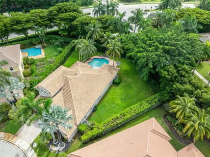 a kitchen with stainless steel appliances a refrigerator and a stove top oven