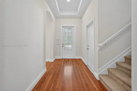 an aerial view of residential house with outdoor space and lake view