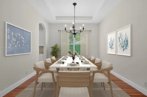 a very nice looking room with a large window and wooden floor