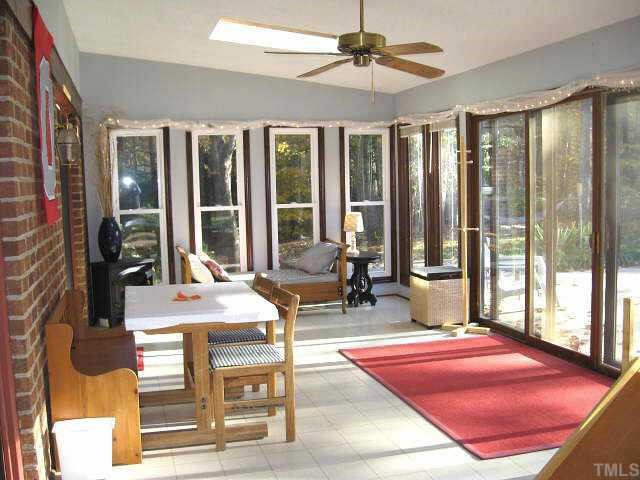 Gorgeous sunroom with ceiling fan & two skylights Other