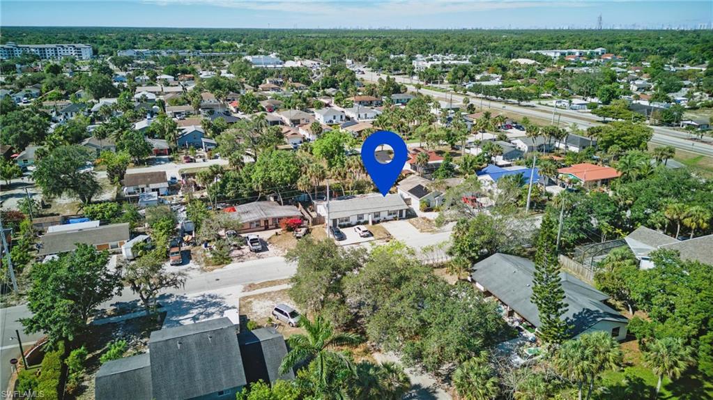 11580 Dean Street, Unit 582 Bonita Springs, FL 34135 - Photo 1 of 22 Aerial overview of property's location with nearby suburban area