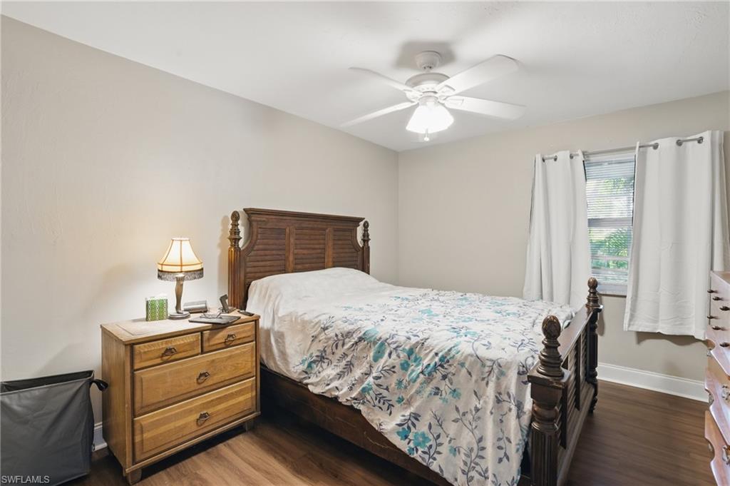 11580 Dean Street, Unit 582 Bonita Springs, FL 34135 - Photo 15 of 22 Bedroom with wood finished floors, baseboards, and ceiling fan