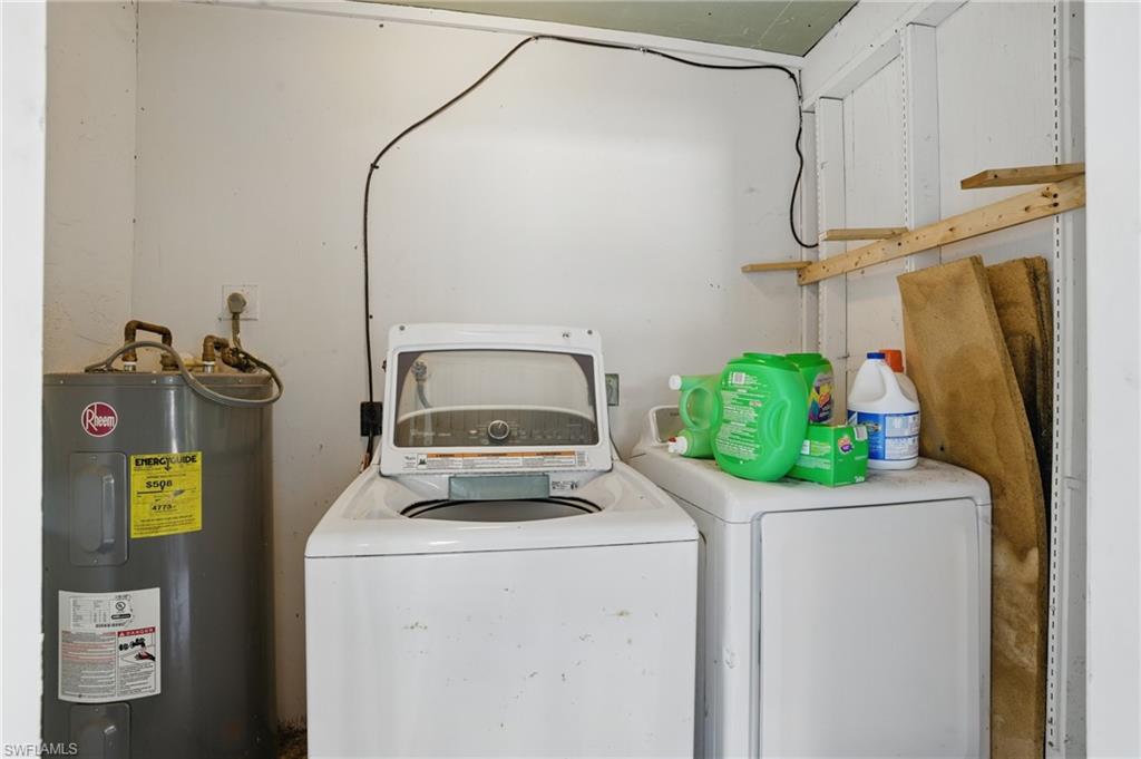 11580 Dean Street, Unit 582 Bonita Springs, FL 34135 - Photo 20 of 22 Washroom featuring water heater and separate washer and dryer
