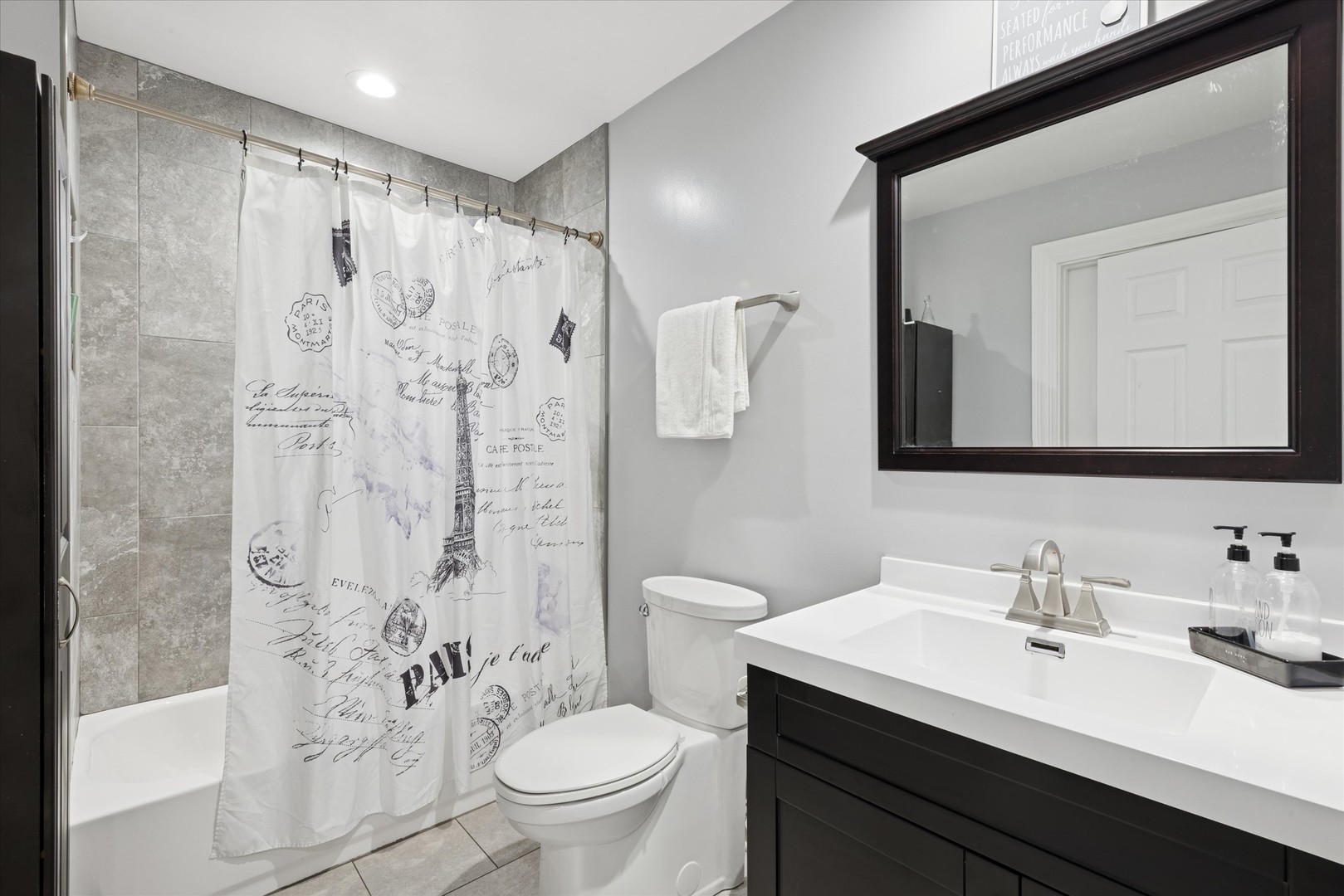 7211 West 58th Place Summit, IL 60501 - Photo 10 of 15 a bathroom with a sink a toilet and shower