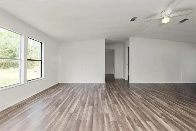 a view of room with window and hardwood floor