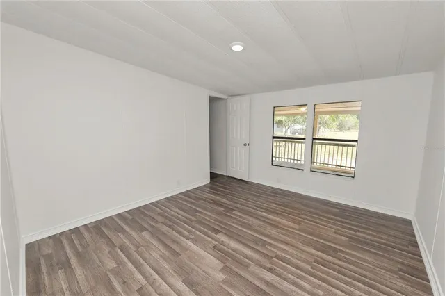 a view of backyard with large windows