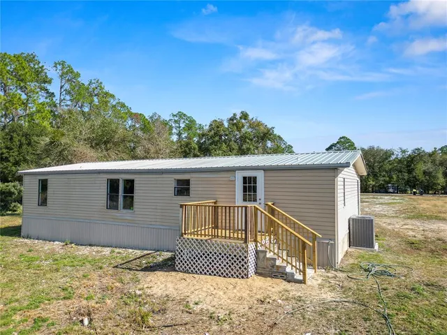 a house with trees in the background