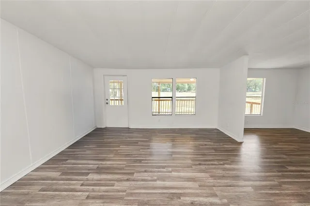 wooden floor in an empty room with window