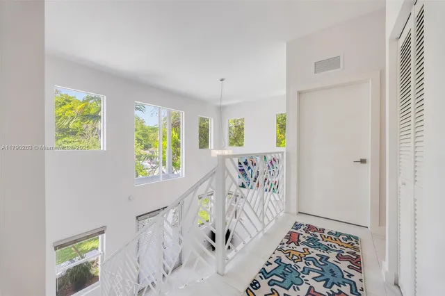 a view of an entryway with wooden floor