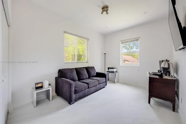 a living room with furniture and a window