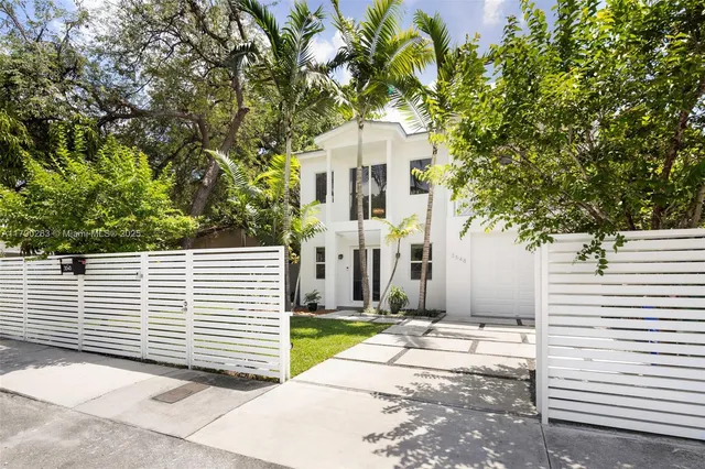 a side view of a house with a yard