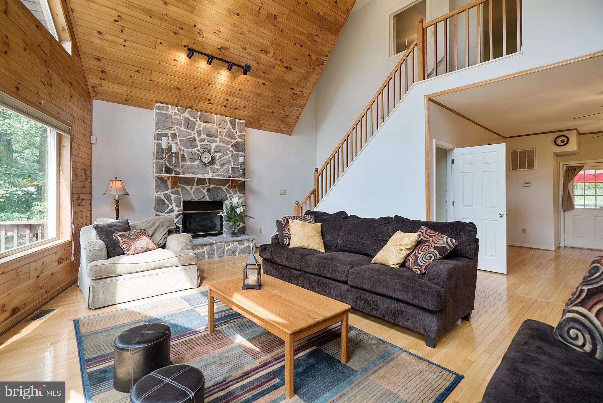 718 Freezeland Road Linden, VA 22642 - Photo 6 of 30 Family Room with Stone Fireplace & Loft