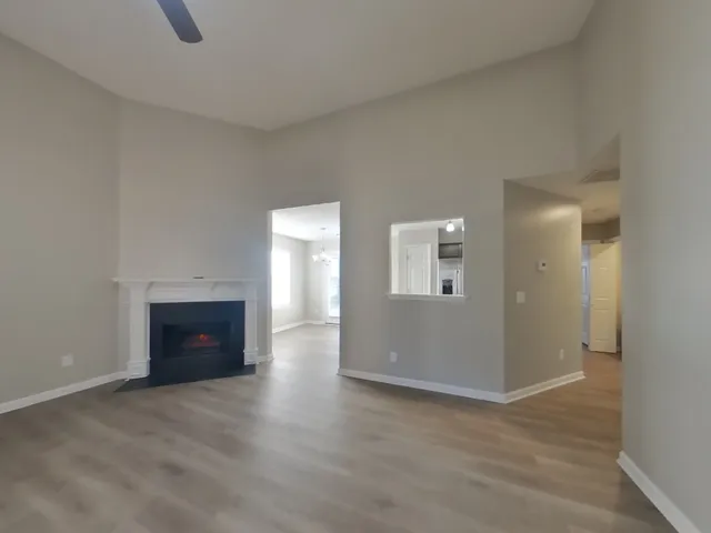 wooden floor and fireplace in an empty room