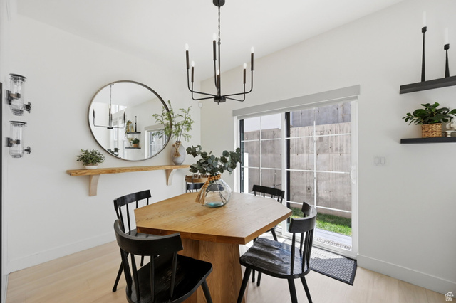 57 McCall Ln. Farmington, UT 84025 - Photo 11 of 36 Dining area featuring a modern black chandelier, and a sliding glass door