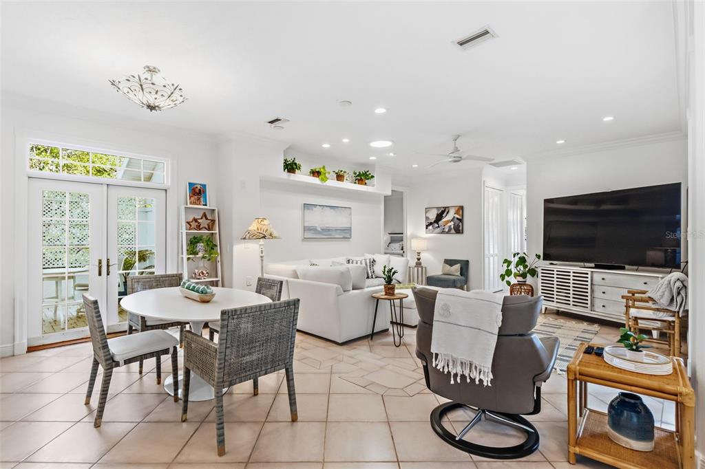 5382 Sandhamn Place Longboat Key, FL 34228 - Photo 13 of 55 a living room with furniture and a flat screen tv