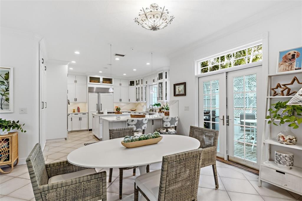 5382 Sandhamn Place Longboat Key, FL 34228 - Photo 14 of 55 a view of a dining room with furniture