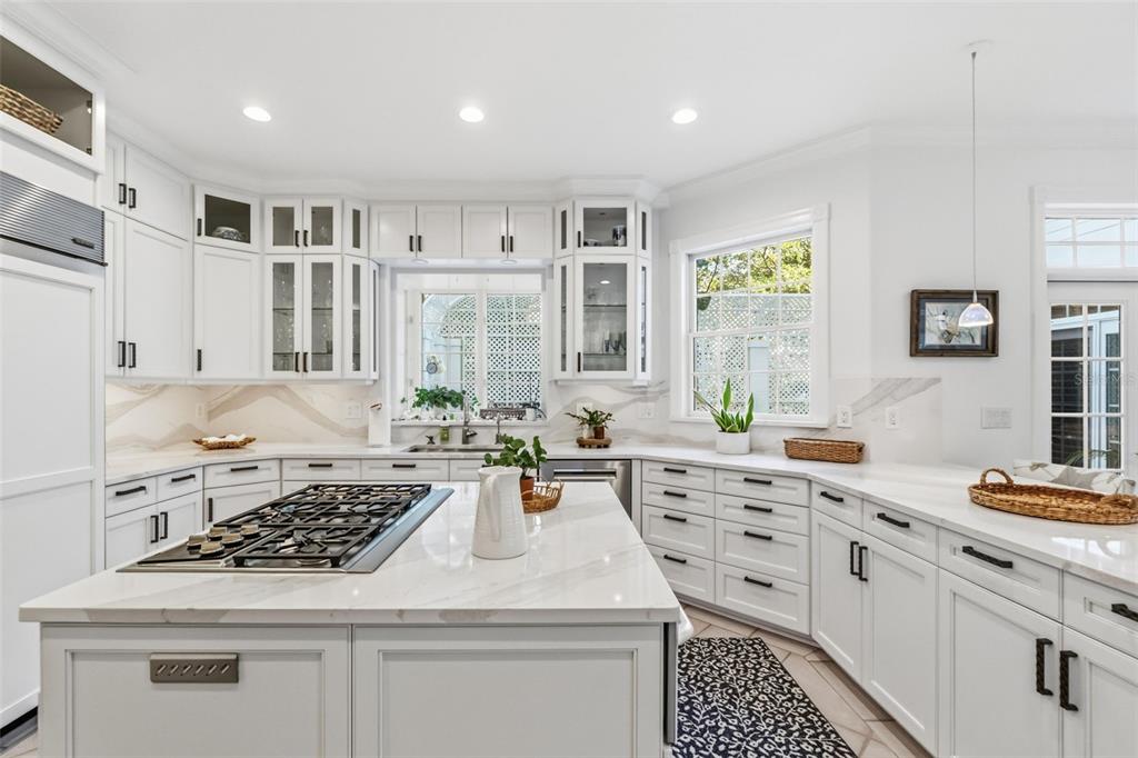 5382 Sandhamn Place Longboat Key, FL 34228 - Photo 16 of 55 a kitchen with a stove a sink a refrigerator and window