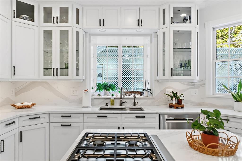 5382 Sandhamn Place Longboat Key, FL 34228 - Photo 17 of 55 a kitchen with a sink stove and window