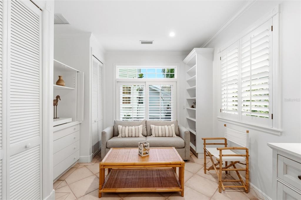 5382 Sandhamn Place Longboat Key, FL 34228 - Photo 22 of 55 a bedroom with furniture and a large window