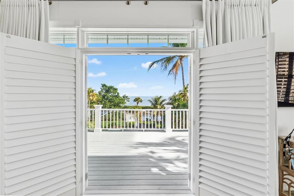 5382 Sandhamn Place Longboat Key, FL 34228 - Photo 27 of 55 a view of a balcony with a swing