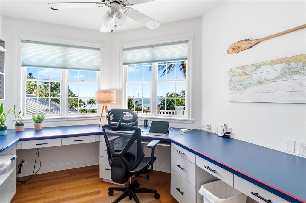 5382 Sandhamn Place Longboat Key, FL 34228 - Photo 28 of 55 a view of a workspace with furniture and a window