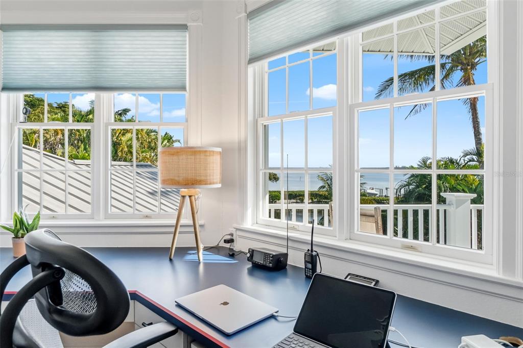 5382 Sandhamn Place Longboat Key, FL 34228 - Photo 29 of 55 a living room with furniture and a window