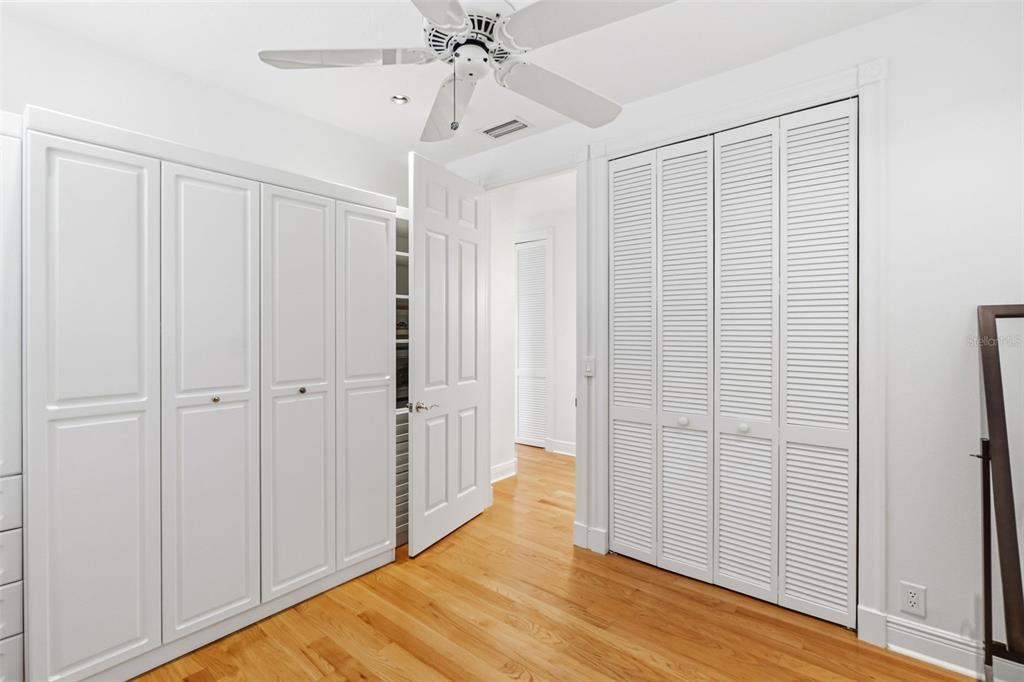5382 Sandhamn Place Longboat Key, FL 34228 - Photo 31 of 55 a view of a room with wooden floor