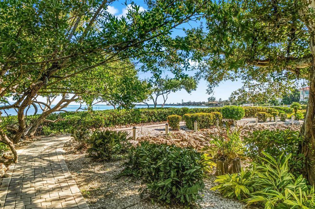 5382 Sandhamn Place Longboat Key, FL 34228 - Photo 40 of 55 a view of a lake with a tree