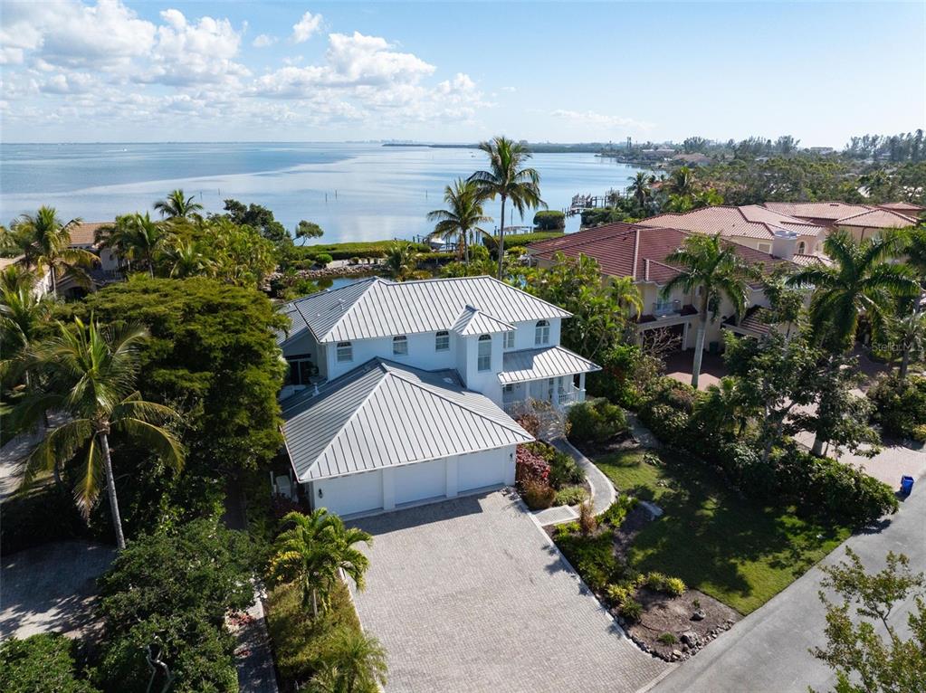5382 Sandhamn Place Longboat Key, FL 34228 - Photo 47 of 55 a view of a houses with a yard