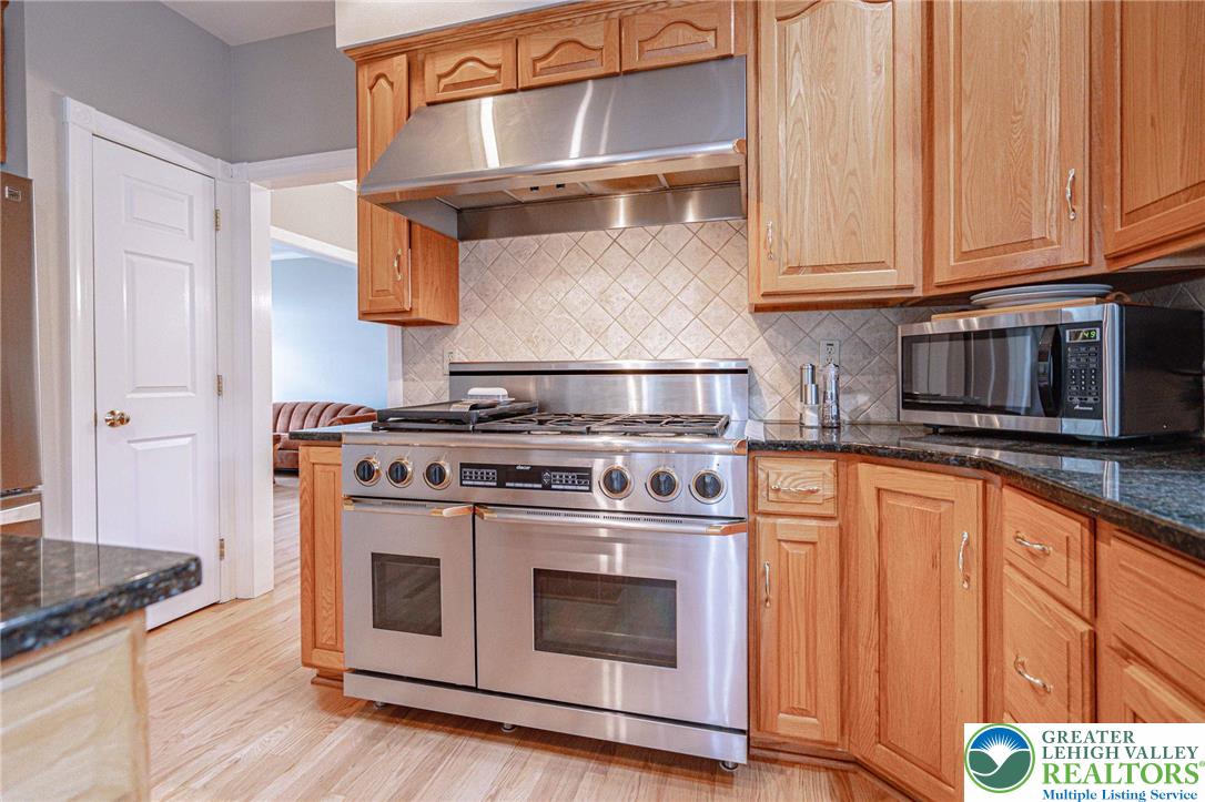 6551 Overlook Road Orefield, PA 18069 - Photo 25 of 82 a stove top oven sitting inside of a kitchen