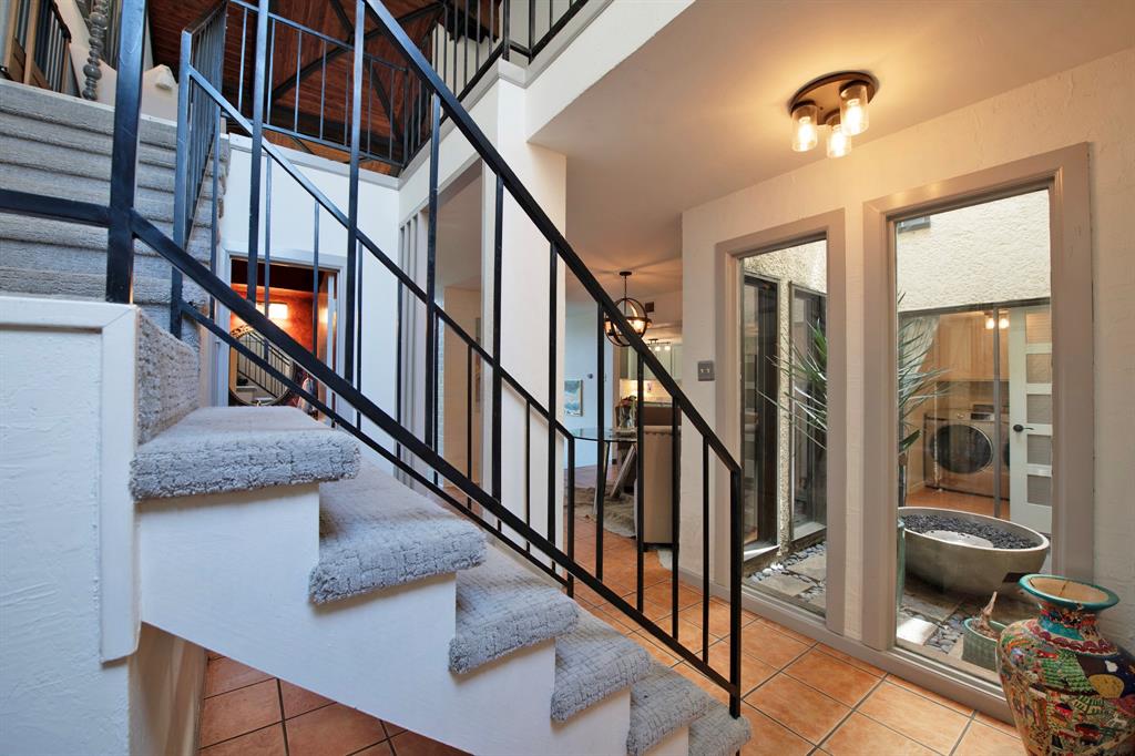 3915 Roma Court Rockwall, TX 75087 - Photo 15 of 40 Stairway with tile patterned flooring