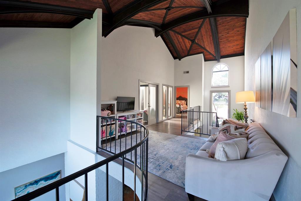 3915 Roma Court Rockwall, TX 75087 - Photo 18 of 40 Living area with wood finished floors, high vaulted ceiling, and a wood ceiling with exposed beams