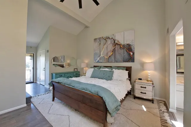 a bedroom with a bed and a cabinets