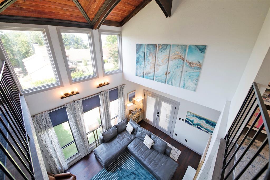 3915 Roma Court Rockwall, TX 75087 - Photo 2 of 40 Living area featuring high vaulted ceiling, healthy amount of natural light, a wood ceiling with exposed beams, and wood finished floors