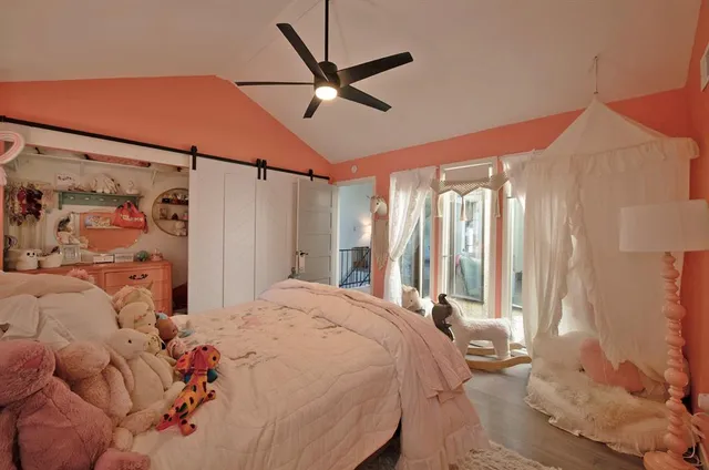 a bed room with a bed and a window