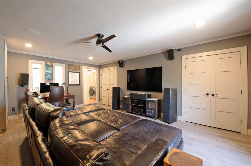 3915 Roma Court Rockwall, TX 75087 - Photo 31 of 40 Living room with recessed lighting, ceiling fan, light wood-style flooring, crown molding, and washer / dryer