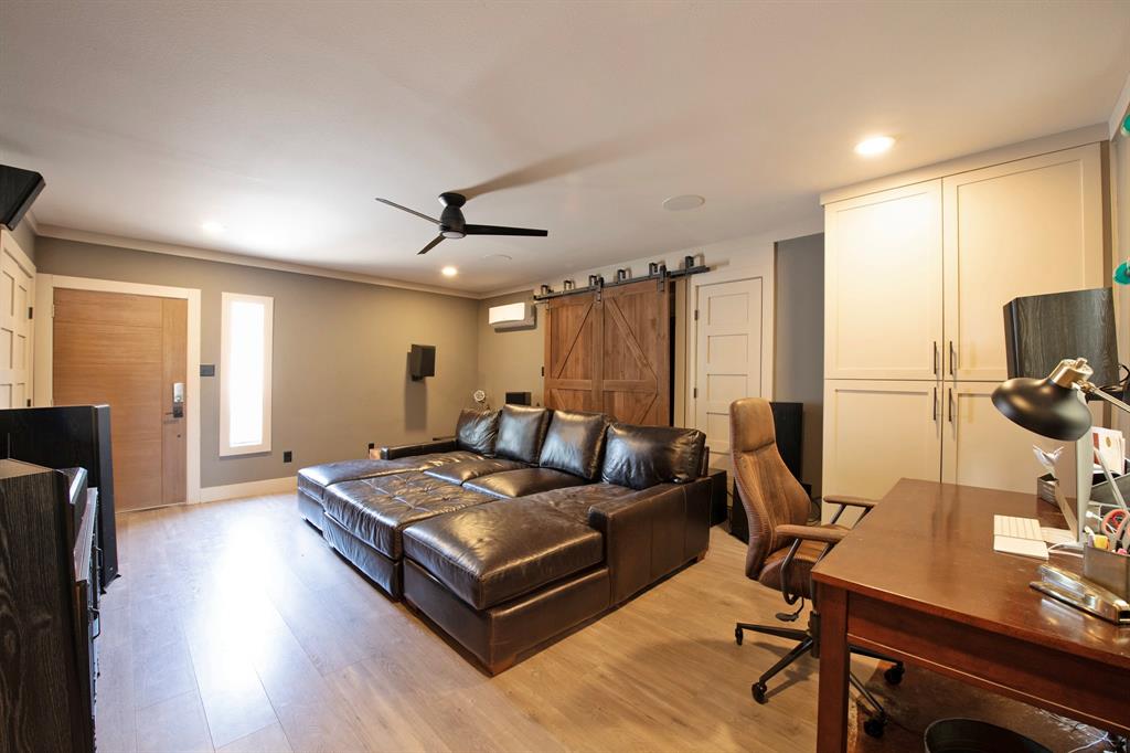 3915 Roma Court Rockwall, TX 75087 - Photo 32 of 40 Bedroom featuring a desk, light wood finished floors, a barn door, recessed lighting, and a ceiling fan